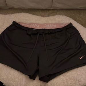 dark purple and pink nike athletic shorts